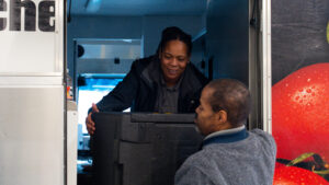 DC Central Kitchen workers loading a distribution truck to feed the first responders of the Potomac River mid-air collision.