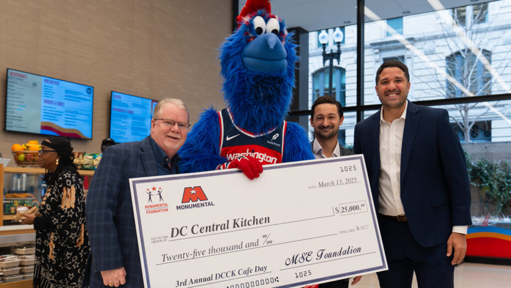 DC Central Kitchen receives a check from Monumental Sports