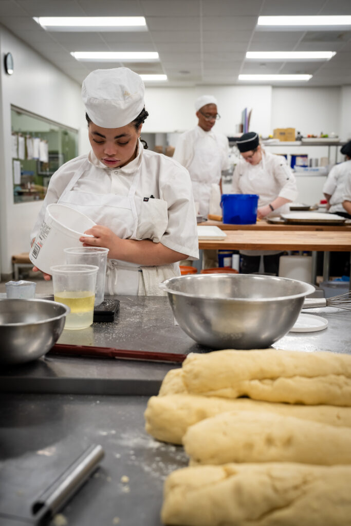 Sunflower Bakery students working in the kitchen.