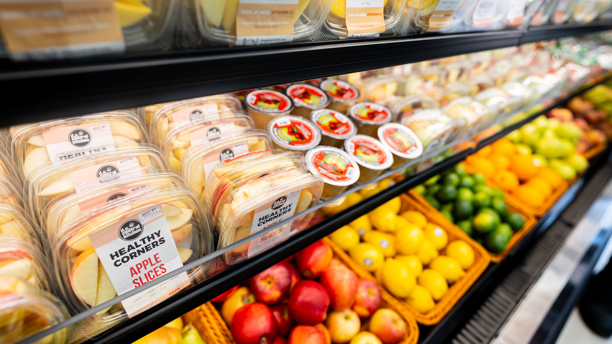 Healthy Corners' fresh fruits on a corner store shelf