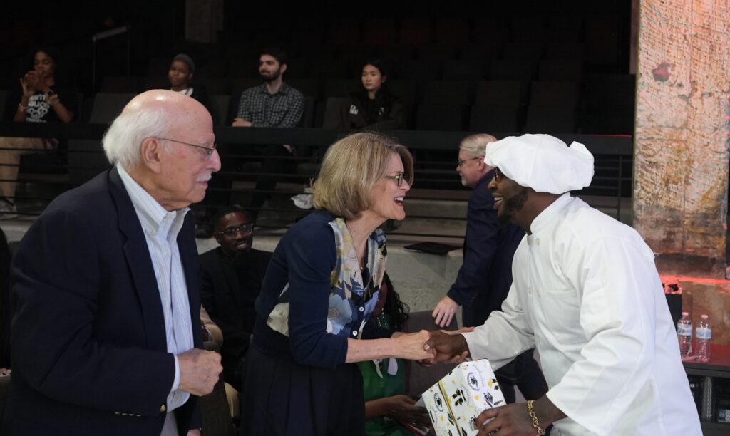 Class speaker Elijah F. with class sponsors Peter and Dia Sherman