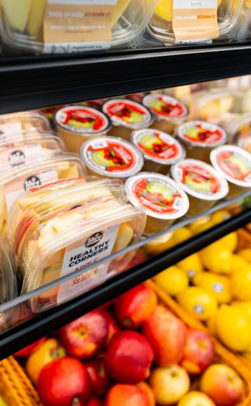 Healthy Corners' fresh fruits on a corner store shelf