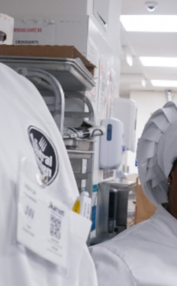 A smiling DC Central Kitchen student